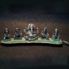 Lord Ganesha sitting on a banana leaf with musicians aluminium idol