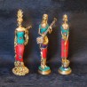 Traditional brass tribal woman figurines with coral dress on top