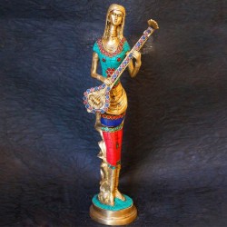 Traditional brass tribal woman figurines with coral dress on top