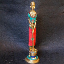 Traditional brass tribal woman figurines with coral dress on top