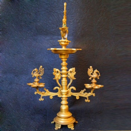 Traditional brass deepa with peacocks on both sides